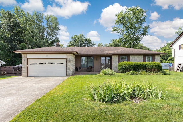 2635 Youngs Grove Rd, Columbus, OH 43231 - view of front of home with stone siding, an attached garage, driveway, and a chimney