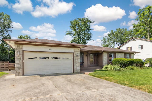 2635 Youngs Grove Rd, Columbus, OH 43231 - view of front of property with stone siding, concrete driveway, a garage, and roof with shingles
