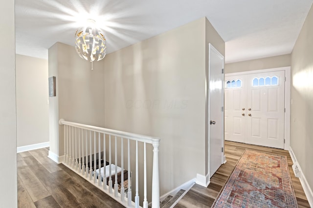 2635 Youngs Grove Rd, Columbus, OH 43231 - entryway featuring wood finished floors and a chandelier