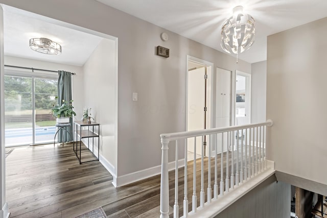2635 Youngs Grove Rd, Columbus, OH 43231 - hall with an upstairs landing, wood finished floors, and a chandelier