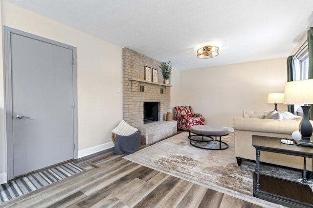 2635 Youngs Grove Rd, Columbus, OH 43231 - living room with wood finished floors and a brick fireplace