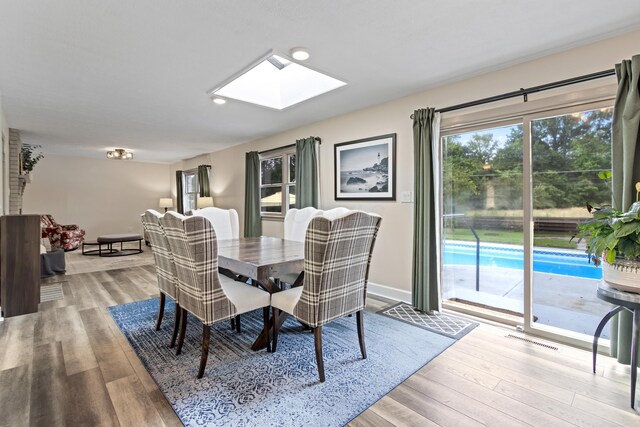 2635 Youngs Grove Rd, Columbus, OH 43231 - dining room with a skylight and wood finished floors