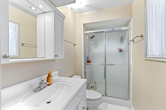 2635 Youngs Grove Rd, Columbus, OH 43231 - bathroom featuring vanity, a stall shower, and tile patterned floors