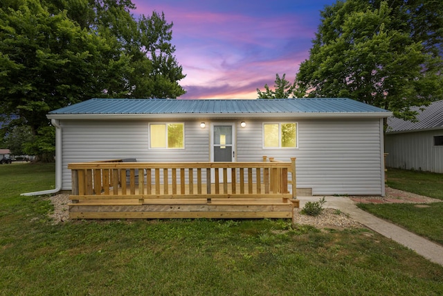 5369 Quincy St, Harpster, OH 43323 - rear view of property with a lawn, a metal roof, and a wooden deck