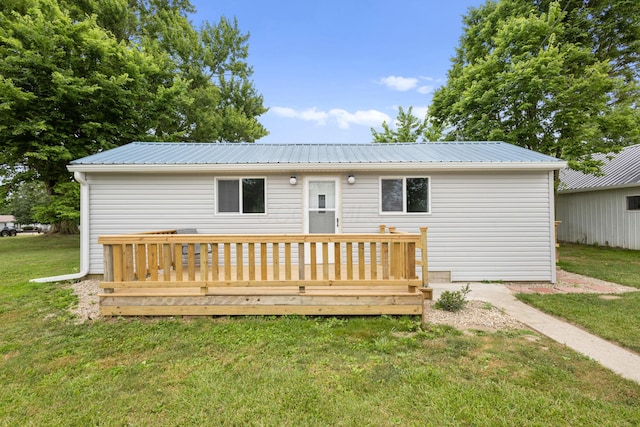 5369 Quincy St, Harpster, OH 43323 - back of house featuring a yard, a metal roof, and a wooden deck