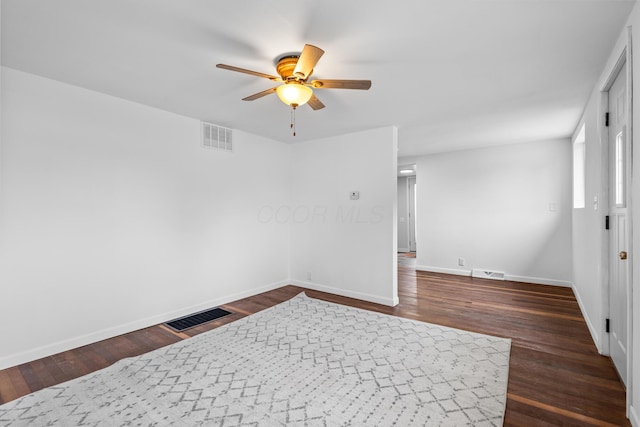 5369 Quincy St, Harpster, OH 43323 - empty room with ceiling fan and dark wood-type flooring