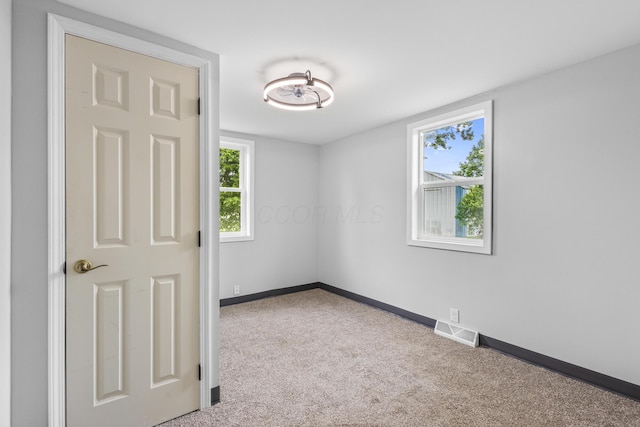 5369 Quincy St, Harpster, OH 43323 - carpeted empty room featuring plenty of natural light