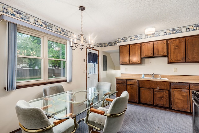 229 Danbury Rd, West Jefferson, OH 43162 - carpeted dining room featuring a chandelier and a textured ceiling