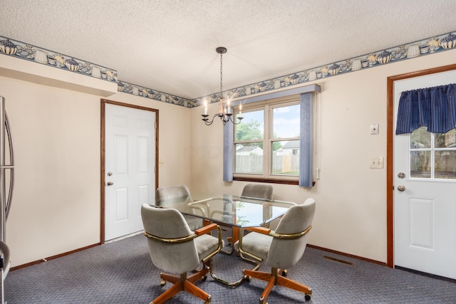 229 Danbury Rd, West Jefferson, OH 43162 - dining area with carpet floors, a chandelier, and a textured ceiling