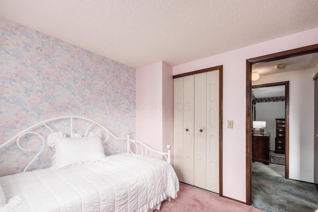 229 Danbury Rd, West Jefferson, OH 43162 - bedroom with carpet floors, a closet, and a textured ceiling