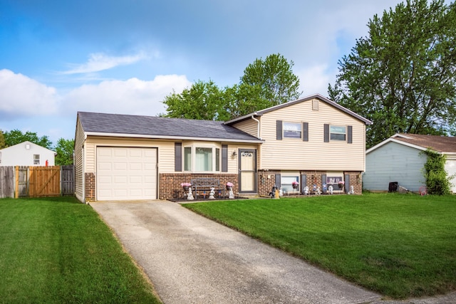 229 Danbury Rd, West Jefferson, OH 43162 - split level home featuring brick siding, driveway, and an attached garage