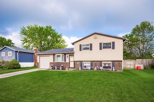229 Danbury Rd, West Jefferson, OH 43162 - tri-level home featuring driveway, brick siding, a garage, and a chimney