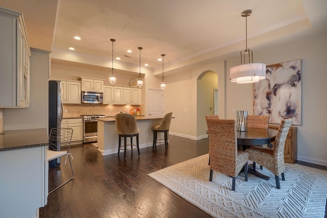 6918 Rothwell St, New Albany, OH 43054 - dining room with arched walkways, ornamental molding, dark wood-style flooring, and recessed lighting