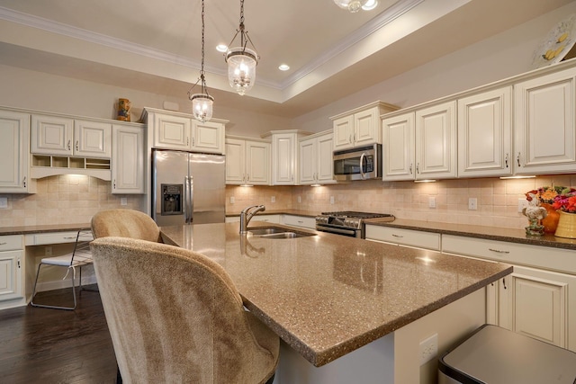 6918 Rothwell St, New Albany, OH 43054 - kitchen featuring appliances with stainless steel finishes, crown molding, backsplash, dark wood-type flooring, and a kitchen bar