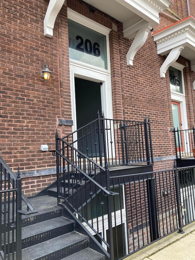1276 N High St Unit 206, Columbus, OH 43201 - doorway to property featuring brick siding