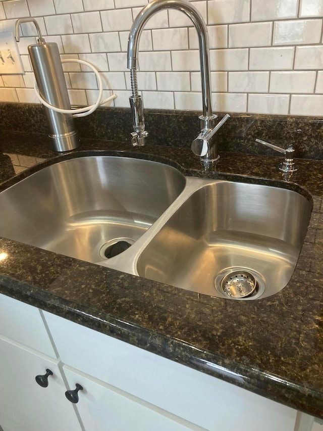 1276 N High St Unit 206, Columbus, OH 43201 - kitchen view of decorative backsplash and dark stone countertops