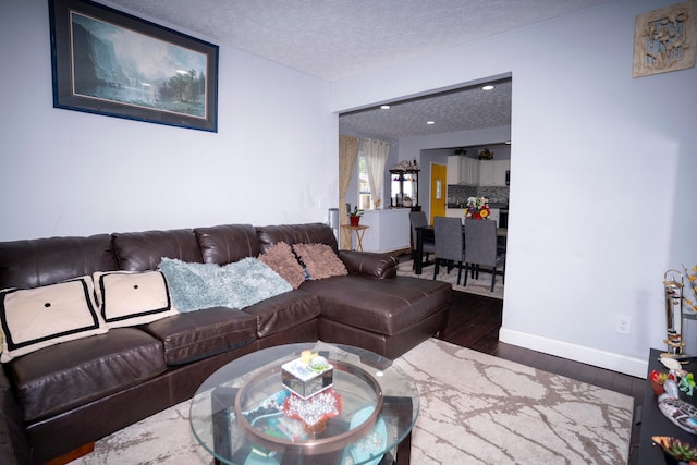 66 S Wheatland Ave, Columbus, OH 43204 - living room featuring wood finished floors and a textured ceiling