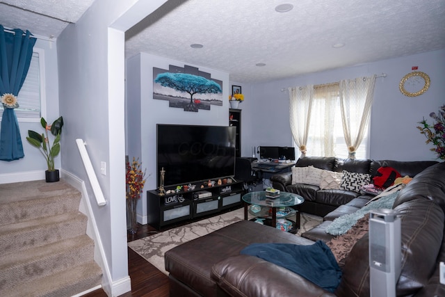 66 S Wheatland Ave, Columbus, OH 43204 - living area with a textured ceiling, stairs, and wood finished floors