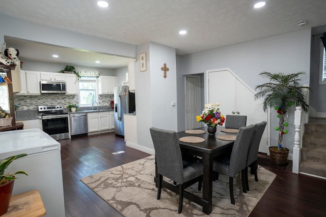 66 S Wheatland Ave, Columbus, OH 43204 - dining room featuring dark wood-style floors, recessed lighting, and a textured ceiling
