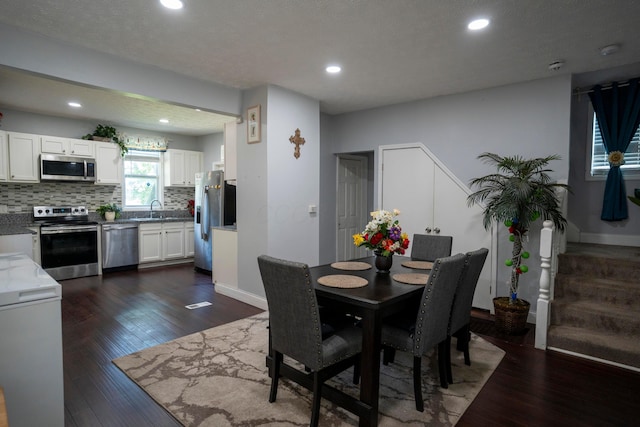 66 S Wheatland Ave, Columbus, OH 43204 - dining area with recessed lighting and dark wood-style floors