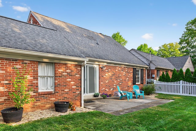 4368 Airendel Ct, Columbus, OH 43220 - rear view of property featuring a patio, brick siding, and a shingled roof