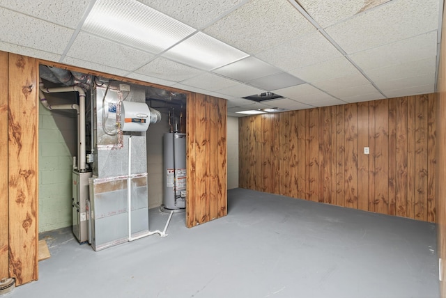 4368 Airendel Ct, Columbus, OH 43220 - finished below grade area featuring gas water heater, heating unit, a drop ceiling, and wood walls