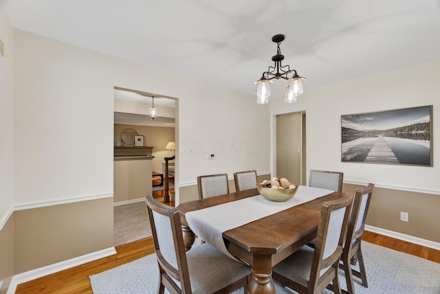 4368 Airendel Ct, Columbus, OH 43220 - dining space featuring a chandelier and wood finished floors
