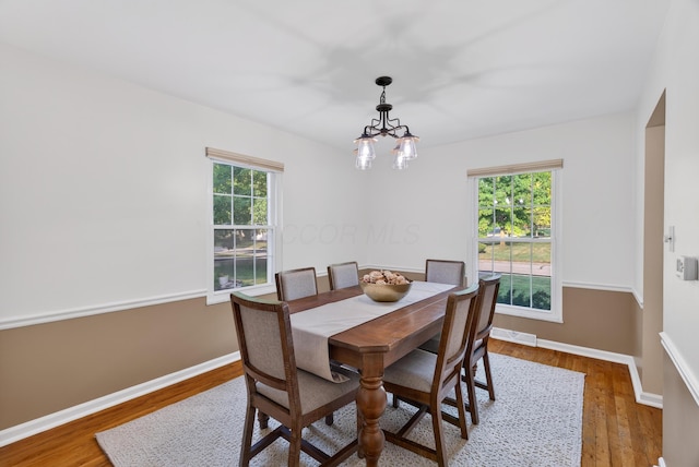 4368 Airendel Ct, Columbus, OH 43220 - dining space with wood finished floors and a chandelier