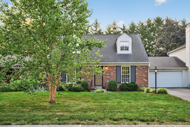 4368 Airendel Ct, Columbus, OH 43220 - cape cod-style house featuring brick siding, a garage, a front yard, concrete driveway, and roof with shingles