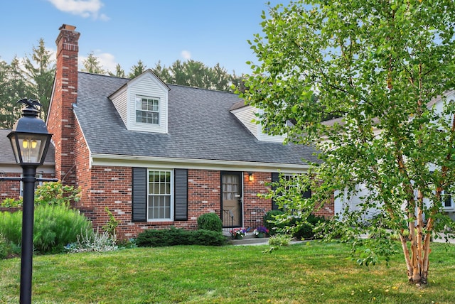 4368 Airendel Ct, Columbus, OH 43220 - cape cod house with brick siding, a front lawn, a chimney, and roof with shingles