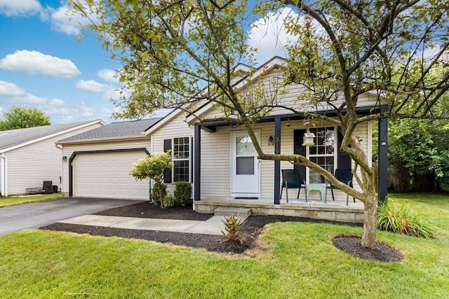 3155 El Greco Dr, Columbus, OH 43204 - view of front of property featuring a porch, asphalt driveway, a garage, and a front lawn