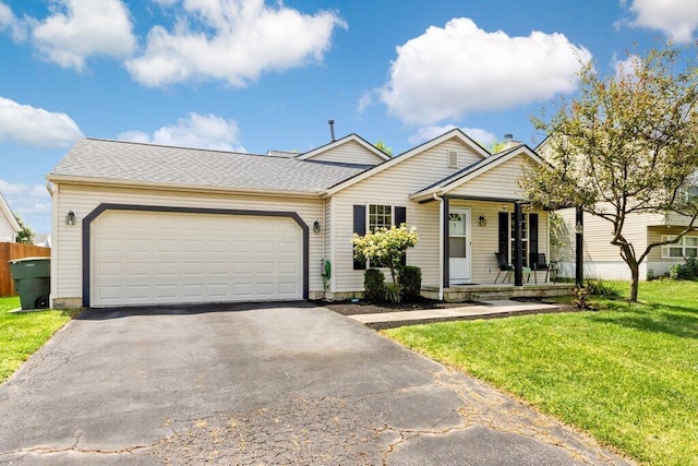 3155 El Greco Dr, Columbus, OH 43204 - single story home with driveway, a garage, a front yard, and a porch