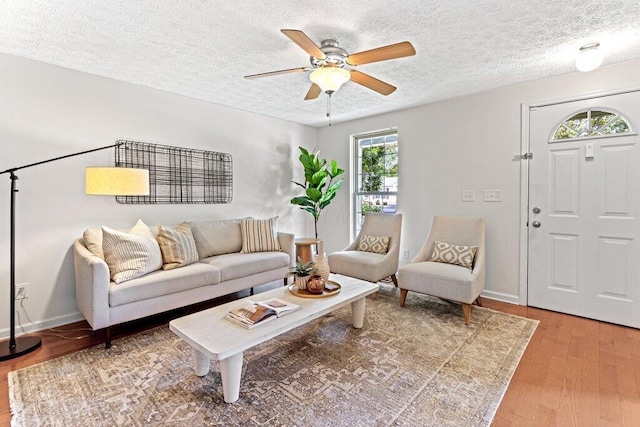 3155 El Greco Dr, Columbus, OH 43204 - living room with ceiling fan, light wood-style floors, and a textured ceiling