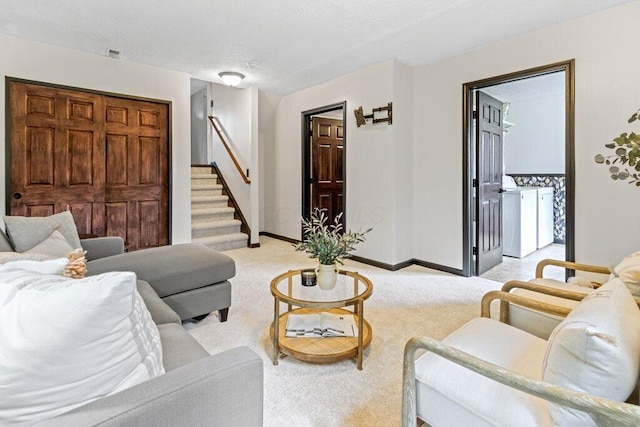 3155 El Greco Dr, Columbus, OH 43204 - living room with light colored carpet, washing machine and dryer, and stairs