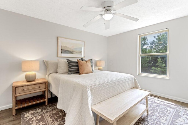 3155 El Greco Dr, Columbus, OH 43204 - bedroom featuring wood finished floors, a textured ceiling, and ceiling fan