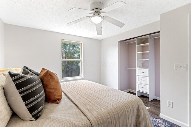 3155 El Greco Dr, Columbus, OH 43204 - bedroom featuring wood finished floors, a ceiling fan, and a textured ceiling