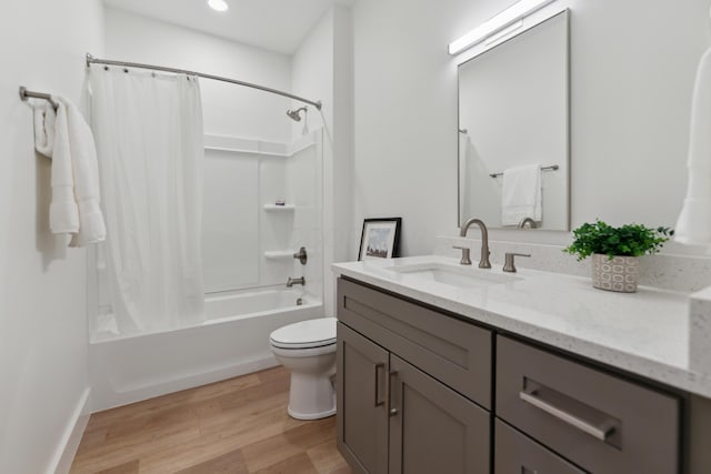 875 Bellows Ave, Columbus, OH 43223 - bathroom with vanity, shower / bathtub combination with curtain, wood finished floors, and recessed lighting