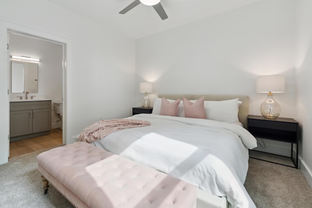 875 Bellows Ave, Columbus, OH 43223 - bedroom featuring light carpet, ensuite bath, and ceiling fan