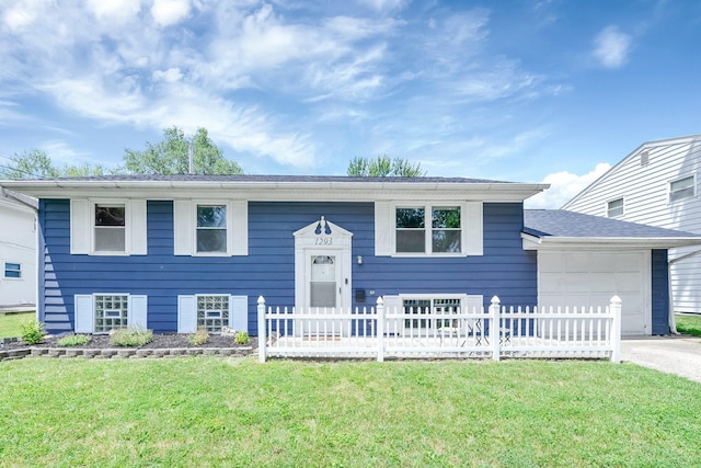 1293 Gresham Rd, Columbus, OH 43204 - bi-level home featuring an attached garage and driveway
