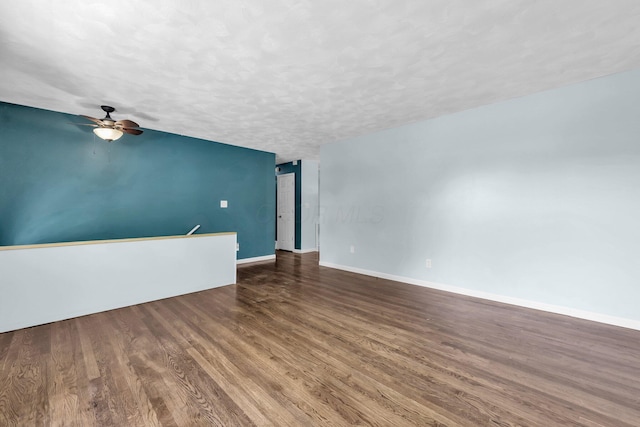 1293 Gresham Rd, Columbus, OH 43204 - unfurnished room featuring wood finished floors, ceiling fan, and a textured ceiling
