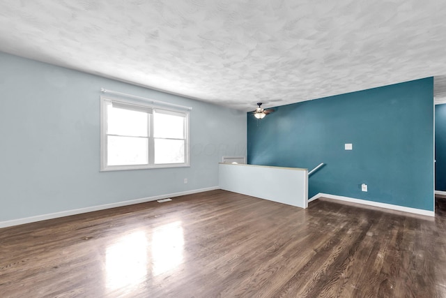 1293 Gresham Rd, Columbus, OH 43204 - empty room featuring ceiling fan, a textured ceiling, and wood finished floors