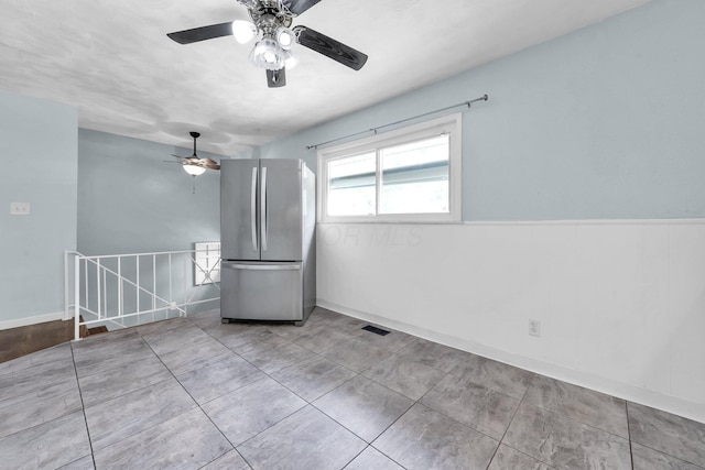 1293 Gresham Rd, Columbus, OH 43204 - empty room featuring ceiling fan and wainscoting