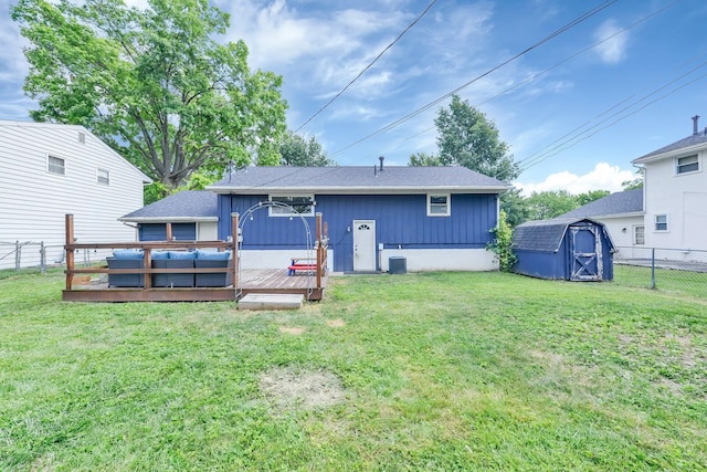 1293 Gresham Rd, Columbus, OH 43204 - rear view of house featuring a fenced backyard, a deck, and a storage shed