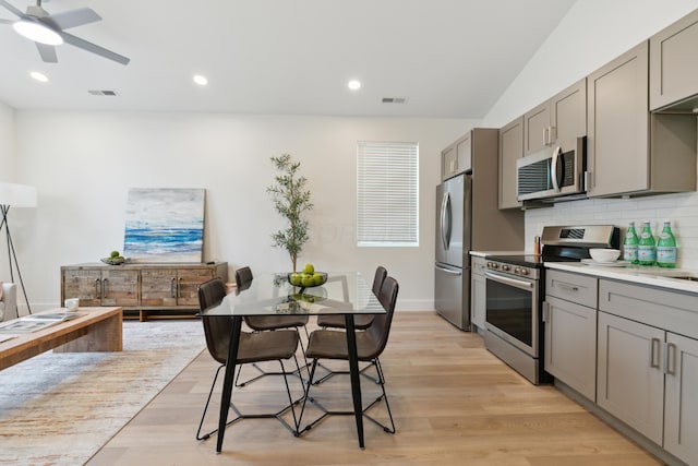 57 N Wheatland Ave, Columbus, OH 43204 - kitchen with stainless steel appliances, gray cabinets, light wood finished floors, a ceiling fan, and recessed lighting