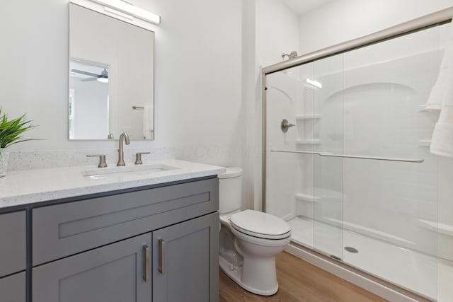 57 N Wheatland Ave, Columbus, OH 43204 - full bath with vanity, a shower stall, and wood finished floors