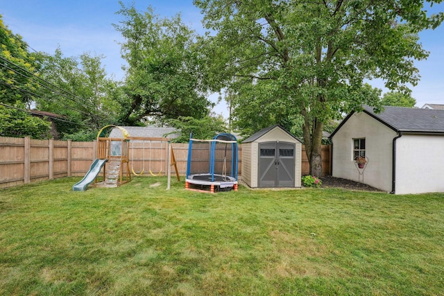 1317 Broadview Ave, Columbus, OH 43212 - fenced backyard featuring a storage shed, a playground, and a trampoline