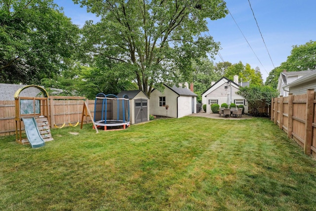 1317 Broadview Ave, Columbus, OH 43212 - fenced backyard featuring a storage unit, a playground, a patio area, and a detached garage