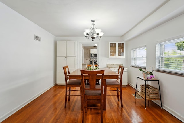 1317 Broadview Ave, Columbus, OH 43212 - dining area with a chandelier and dark wood-style flooring