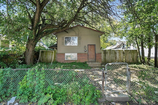31 S Wheatland Ave, Columbus, OH 43204 - view of front facade featuring a gate and brick siding