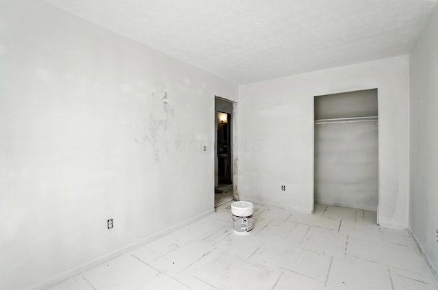 31 S Wheatland Ave, Columbus, OH 43204 - unfurnished bedroom with a closet and a textured ceiling